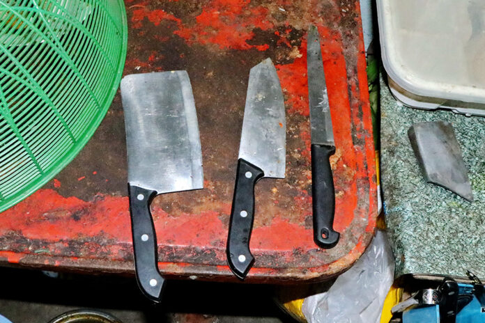 Kitchen knives laid out by police investigators Monday at the house where a man confessed to using one to cut off his colleague’s penis. Kitchen knives laid out by police investigators Monday at the house where a man confessed to using one to cut off his colleague’s penis.
