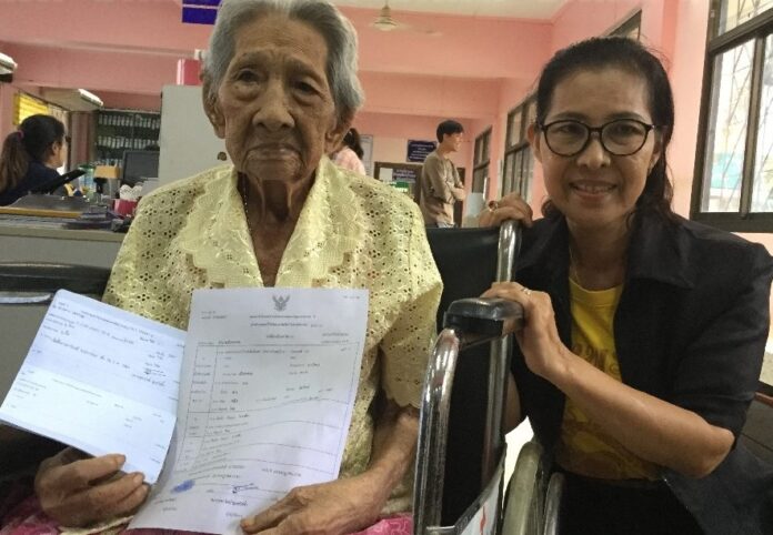 Khan Saiyai, left, received her ID card Monday in Trat province. Khan Saiyai, left, received her ID card Monday in Trat province.