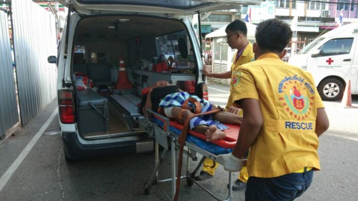 Rescue workers bring the victim to a hospital Monday.