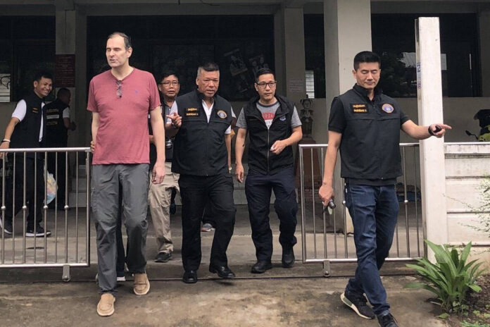 Police arrest Anthony James Bennett at his house Tuesday evening in Phasi Charoen District.