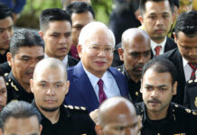 Malaysia’s Najib Charged With Breach of Trust, Graft Former Malaysian Prime Minister Najib Razak, center, arrives at a court house Wednesday in Kuala Lumpur, Malaysia. Photo: Vincent Thian / Associated Press
