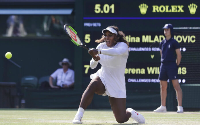 Serena Williams of the United States returns the ball to France's Kristina Mladenovic during their women's singles match, on the fifth day of the Wimbledon Tennis Championships on Friday in London. Photo: Ben Curtis / Associated Press