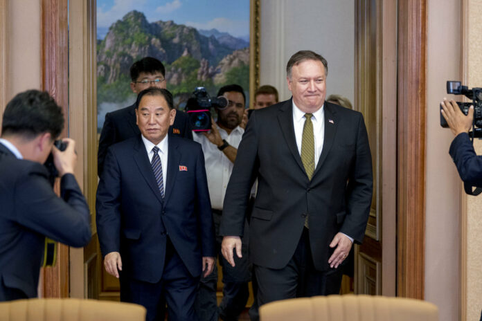 U.S. Secretary of State Mike Pompeo, right, and Kim Yong Chol, left, a North Korean senior ruling party official and former intelligence chief, return to discussions after a break at Park Hwa Guest House on Saturday in Pyongyang, North Korea. Photo: Andrew Harnik / Associated Press