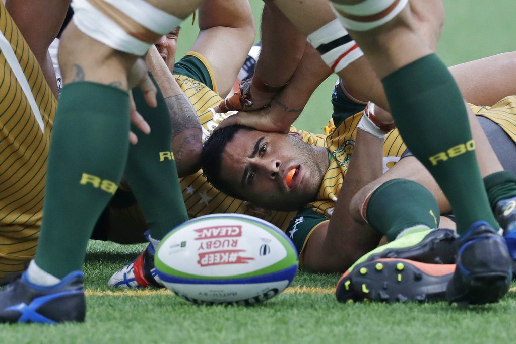 Brynn Uriarau of Cook Islands is tackled Saturday by Hong Kong's rugby team during their play off match of the qualifier round for the 2019 Rugby World Cup in Hong Kong. Photo: Kin Cheung / Associated Press