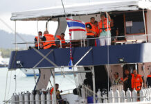 China Warns Travelers to Be Safe on Water Abroad Tourists look out from a tour boat July 8 at Chalong pier in Phuket. Photo: Vincent Thian / Associated Press