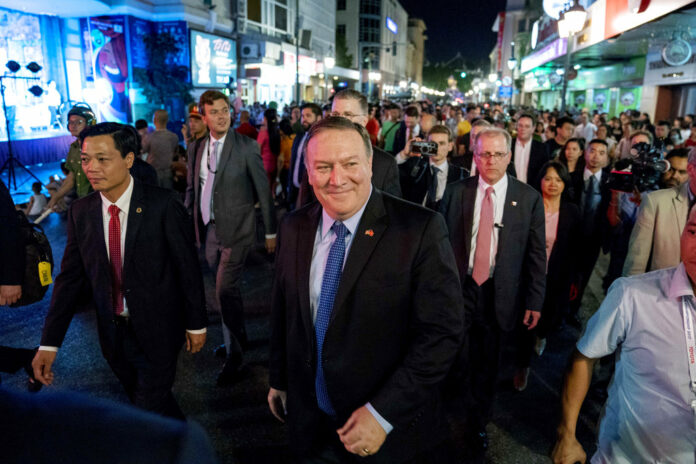 Secretary of State Mike Pompeo, center, walks on Sunday through the streets of Hanoi, Vietnam. Photo: Andrew Harnik / Associated Press Secretary of State Mike Pompeo, center, walks on Sunday through the streets of Hanoi, Vietnam. Photo: Andrew Harnik / Associated Press