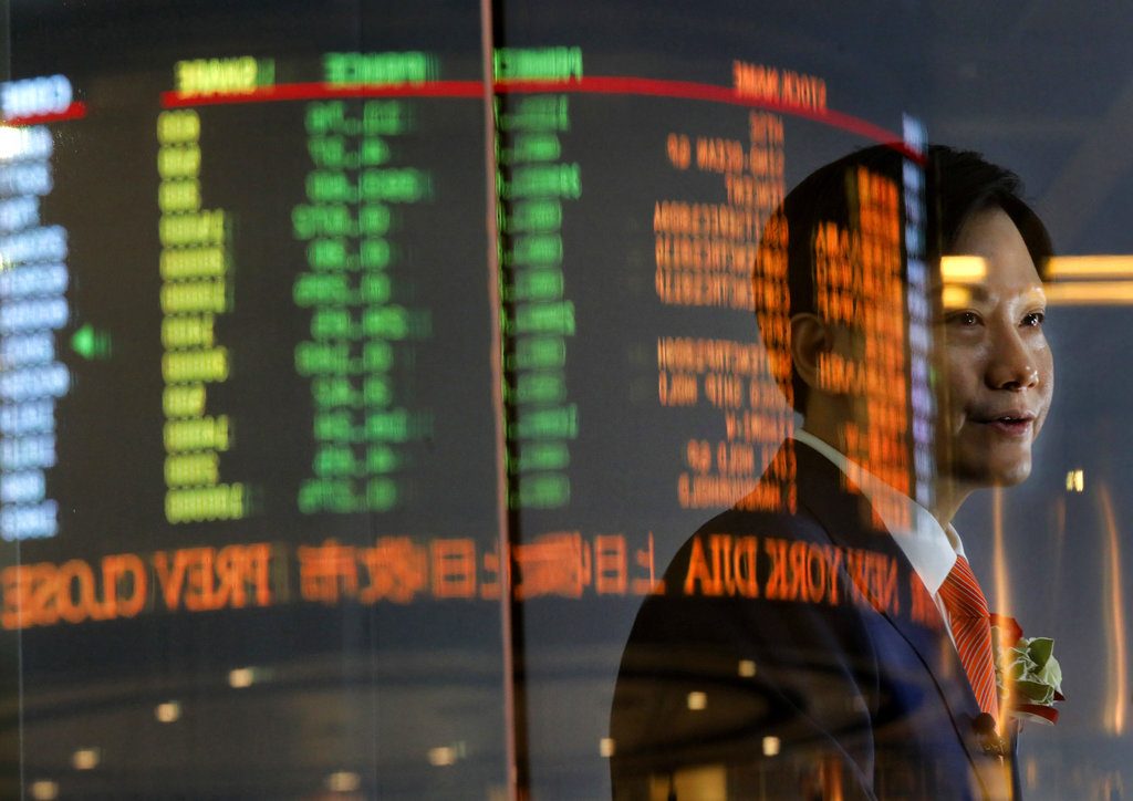 Xiaomi's Founder, Chairman and CEO Lei Jun receives an interview after the listing ceremony at the Hong Kong Stock Exchange on Monday in Hong Kong. Photo: Vincent Yu / Associated Press