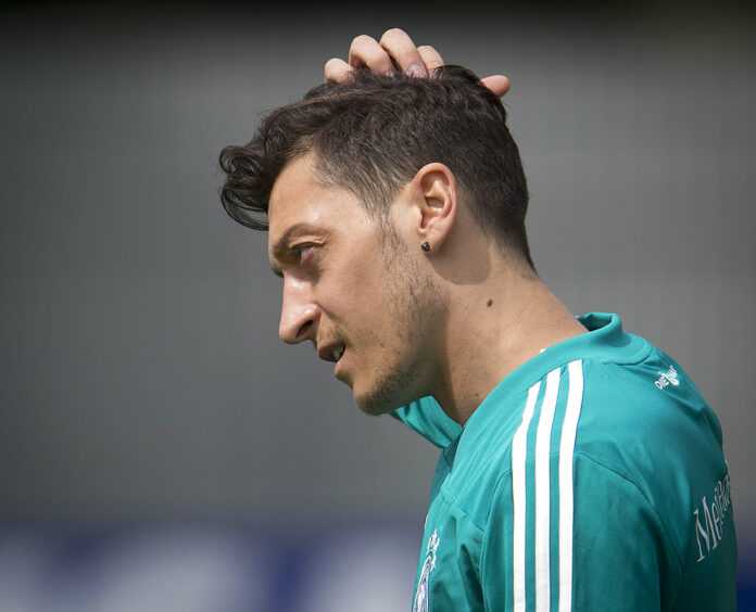 Mesut Ozil scratches his head during a training session of the German team at the 2018 football World Cup in June in Vatutinki near Moscow, Russia. Photo: Michael Probst / Associated Press