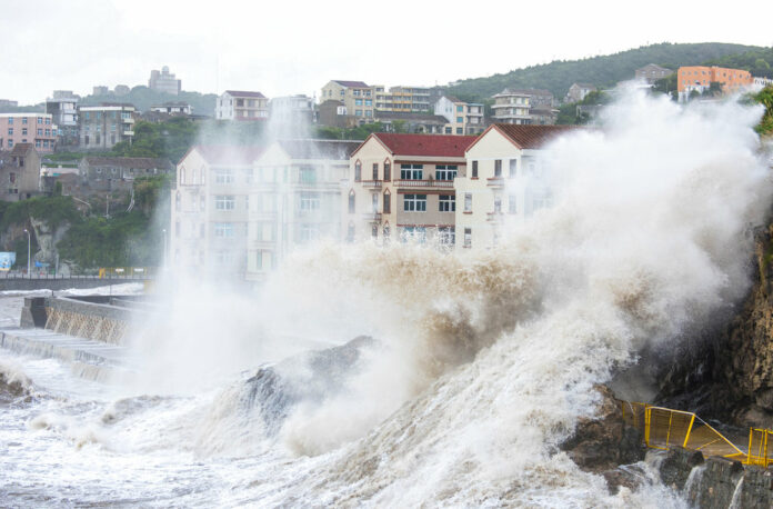 Large waves crash against the shoreline Tuesday as Typhoon Maria approaches in Wenling city in eastern China's Zhejiang Province. Photo: Zhu Haiwei / Associated Press Large waves crash against the shoreline Tuesday as Typhoon Maria approaches in Wenling city in eastern China's Zhejiang Province. Photo: Zhu Haiwei / Associated Press
