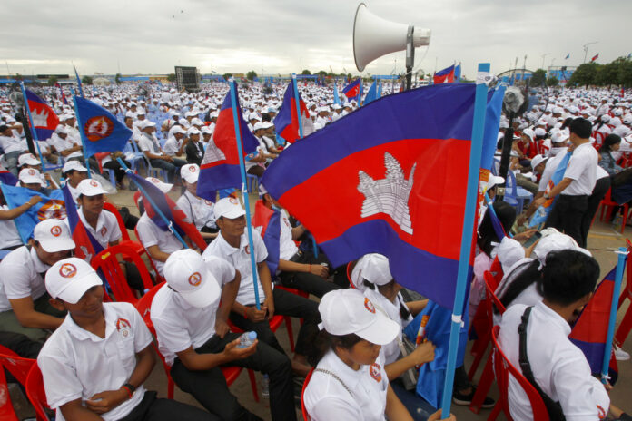Supporters wait for the start of a campaign rally of Cambodian Prime Minister Hun Sen's Cambodian People's Party on Saturday in Phnom Penh, Cambodia. Photo: Heng Sinith / Associated Press