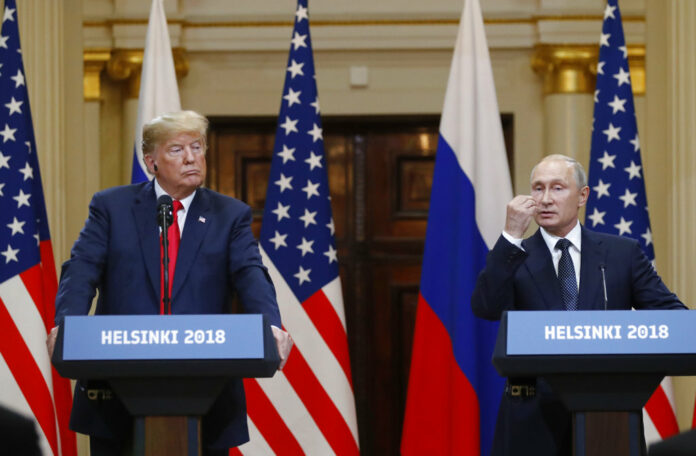 U.S. President Donald Trump, left, listens to Russian President Vladimir Putin in 2018 during a press conference after their meeting at the Presidential Palace in Helsinki, Finland. Photo: Alexander Zemlianichenko / Associated Press