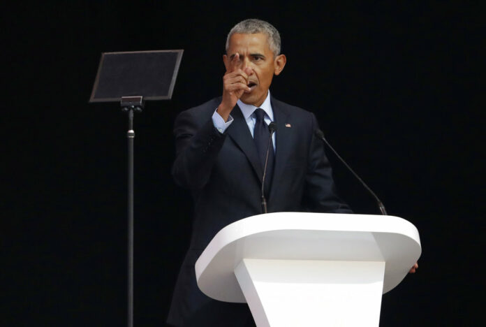 Former U.S. President Barack Obama, left, delivers his speech at the 16th Annual Nelson Mandela Lecture at the Wanderers Stadium on Tuesday in Johannesburg, South Africa Photo: Themba Hadebe / Associated Press