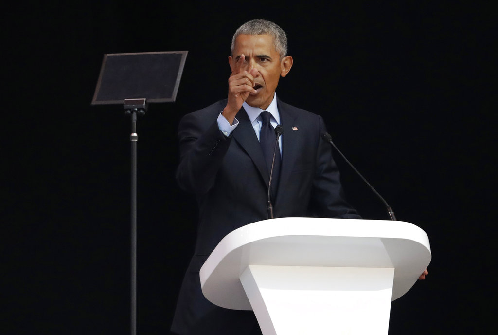 Former U.S. President Barack Obama, left, delivers his speech at the 16th Annual Nelson Mandela Lecture at the Wanderers Stadium on Tuesday in Johannesburg, South Africa Photo: Themba Hadebe / Associated Press Former U.S. President Barack Obama, left, delivers his speech at the 16th Annual Nelson Mandela Lecture at the Wanderers Stadium on Tuesday in Johannesburg, South Africa Photo: Themba Hadebe / Associated Press