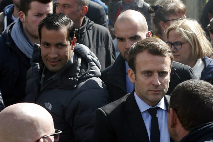 Emmanuel Macron, right, is flanked in 2017 by his bodyguard, Alexandre Benalla, left, outside the Whirlpool home appliance factory, in Amiens, northern France. Photo: Thibault Camus / Associated Press