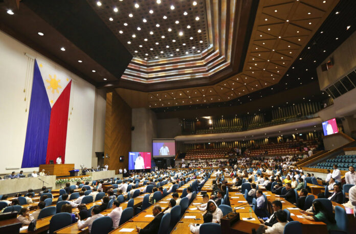 Philippine House Speaker Pantaleon Alvarez, left, speaks during the Third regular session of the 17th Congress on Monday in Quezon city, metropolitan Manila, Philippines. Photo: Aaron Favila / Associated Press