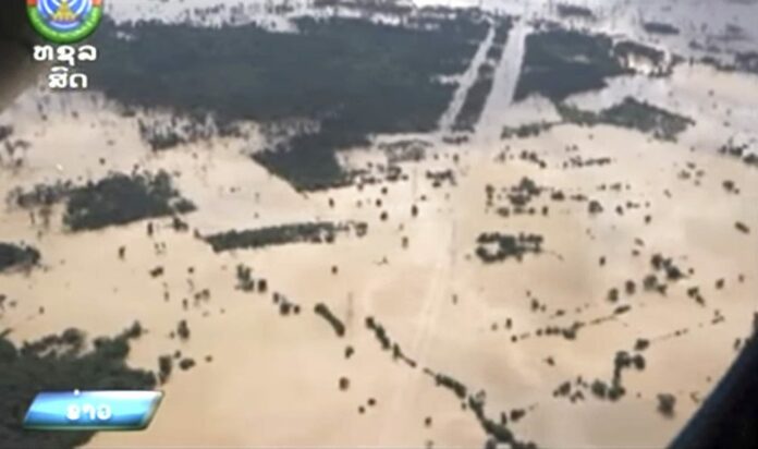 In the image made from aerial video taken on July 24, villages are inundated with floodwaters from a collapsed dam in Attapeu province, southeastern Laos. Photo: LNT via Associated Press
