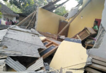 At Least 10 Dead as 6.4 Quake Hits Indonesia Island In this image made from video released by Indonesia's Disaster Mitigation Agency, a man inspects the damage caused by an early Sunday morning earthquake on the island of Lombok, Indonesia. Photo: Indonesia's Disaster Mitigation Agency via AP