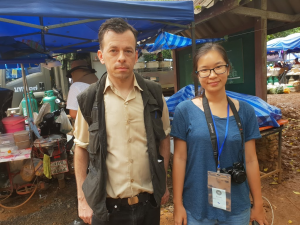Jintamas Saksornchai and editor Todd Ruiz outside the Luang cave complex in Chiang Rai province.