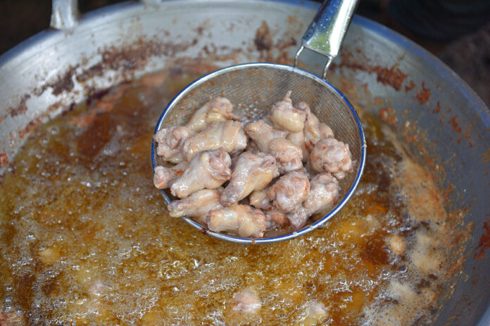 Fried chicken Thursday morning at the Tham Luang Nang Non camp.