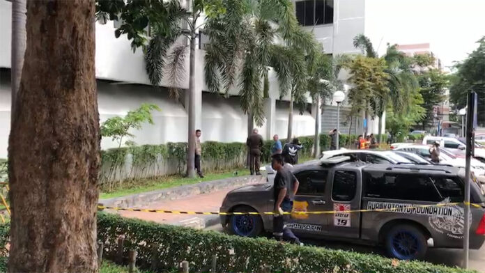Police and rescuers at the scene outside the Court of Justice Monday where a man jumped to his death after the lead suspect in his son's murder case was acquitted. Police and rescuers at the scene outside the Court of Justice Monday where a man jumped to his death after the lead suspect in his son's murder case was acquitted.