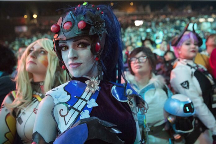 Cosplayer fans watch the competition between Philadelphia Fusion and London Spitfire during the Overwatch League Grand Finals competition on Saturday at Barclays Center in the Brooklyn borough of New York. Photo: Mary Altaffer / Associated Press