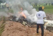 Reporters, Pilots Killed in Khon Kaen Helicopter Crash A rescuer at the scene where a helicopter crashed in Khon Kaen province Wednesday morning.