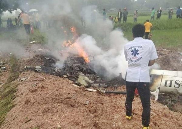 A rescuer at the scene where a helicopter crashed in Khon Kaen province Wednesday morning.