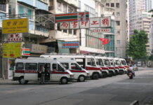 Doctor Accused of Killing Family With Gas-Filled Yoga Ball Police vans in 2004 in Hong Kong. Photo: Gp03dhk / Associated Press