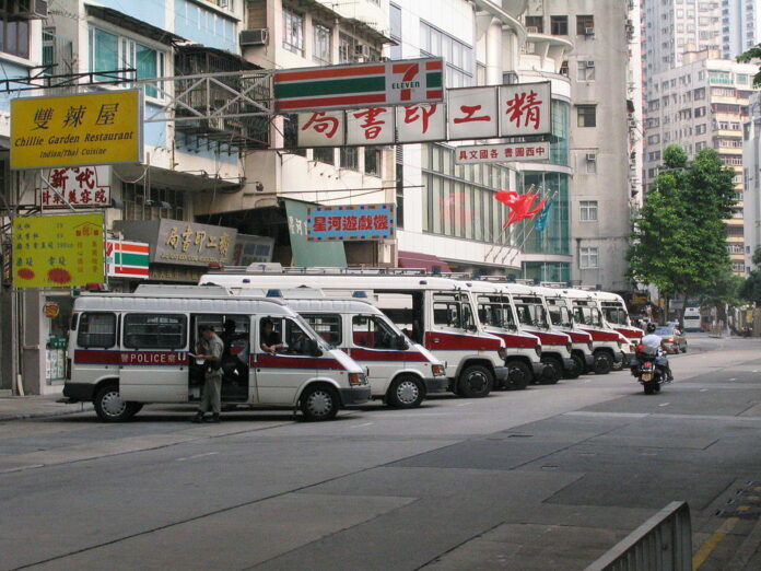 Police vans in 2004 in Hong Kong. Photo: Gp03dhk / Associated Press