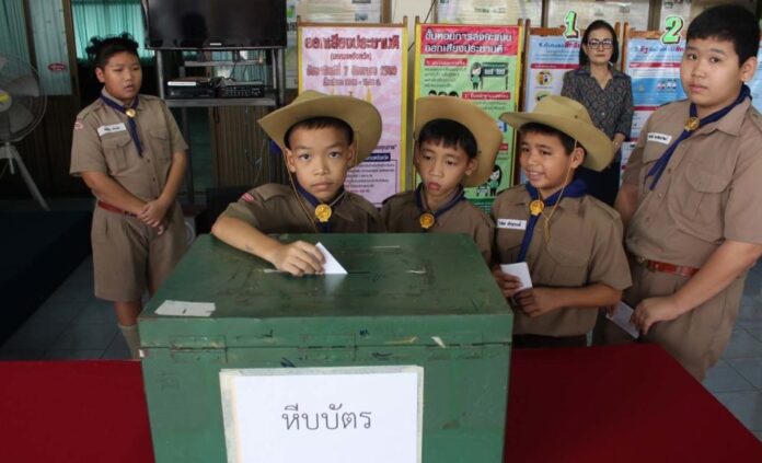 Elementary school students participate in a mock election to learn about democracy on July 22, 2017, in Samut Songkhram province.