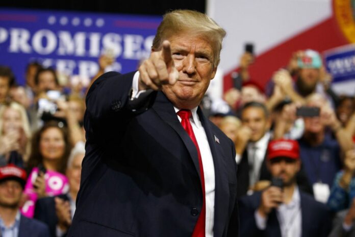 President Donald Trump on Tuesday arrives for a campaign rally at Florida State Fairgrounds Expo Hall in Tampa, Fla. Photo: Evan Vucci / Associated Press