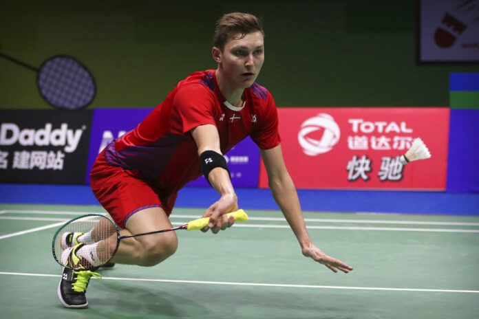 Viktor Axelsen of Denmark plays a shot against Huang Yuxiang of China during their men's badminton singles match at the BWF World Championships on Wednesday in Nanjing, China. Photo: Mark Schiefelbein / Associated Press