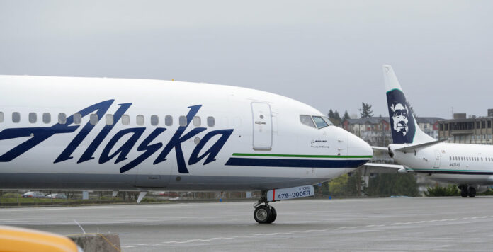 An Alaska Airlines plane taxis Friday, April 13, 2018, at the Seattle-Tacoma International Airport in Seattle. Photo: Ted S. Warren / Associated Press