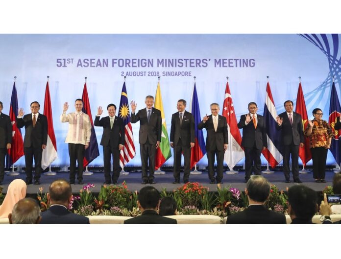 ASEAN foreign ministers pose for a photo ahead of the 51st ASEAN Foreign Ministers Meeting on Thursday in Singapore. Photo: Yong Teck Lim / Associated Press