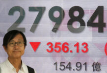 Asian Markets Extend Losses on China-US Trade Jitters A man stands Thursday in front of an electronic board showing Hong Kong share index outside a bank in Hong Kong. Photo: Kin Cheung / Associated Press