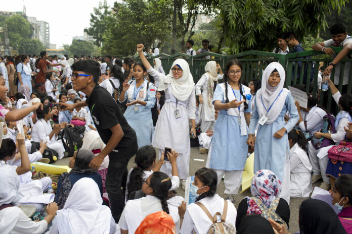 Bangladeshi students shout slogans and block a road Saturday during a protest in Dhaka, Bangladesh. Photo: A. M. Ahad / Associated Press