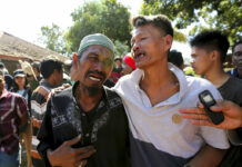 Quakes Cut Power, Topple Homes on Indonesia Island; 3 Dead Relatives react as rescue teams recover the bodies of victims killed in an earthquake in North Lombok, Indonesia, Tuesday, Aug. 7, 2018. Photo: Tatan Syuflana / Associated Press