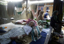 Quake Put Life on Hold in Damaged, Hungry Indonesian Village An elderly man injured in an earthquake lies at a temporary shelter Wednesday in the Kekait village affected by Sunday's earthquake in North Lombok, Indonesia. Photo: Firdia Lisnawati / Associated Press