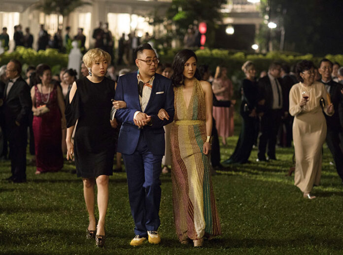 This image released by Warner Bros. Entertainment shows Awkwafina, from left, Nico Santos and Constance Wu in a scene from the film This image released by Warner Bros. Entertainment shows Awkwafina, from left, Nico Santos and Constance Wu in a scene from the film