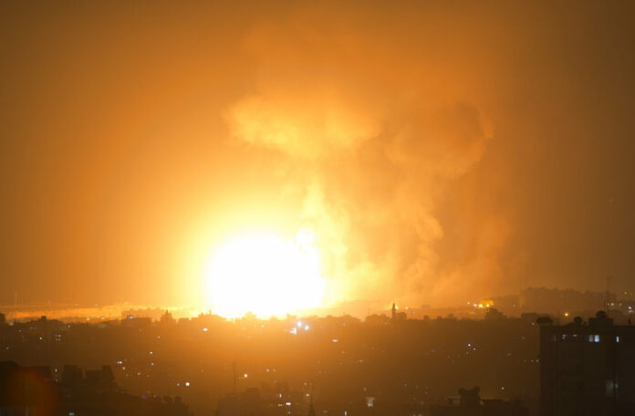 A Thursday explosion caused by Israeli airstrikes on Gaza City. Photo: Khalil Hamra / Associated Press