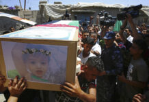 Hamas Says Gaza Cease-Fire Reached With Israel Palestinian mourners carry the coffin of 23-year-old pregnant mother Enas Khamash and her daughter Bayan, whose picture is on the coffin, Thursday during their funeral in Deir el-Balah, central Gaza Strip. Photo: Adel Hana / Associated Press