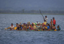 Myanmar Snubs Hague Court’s Intervention in Rohingya Crisis Rohingya Muslims aboard a makeshift raft made with plastic containers cross over the Naf river from Myanmar into Bangladesh, nearin 2017 in Shah Porir Dwip, Bangladesh. Photo: A.M. Ahad / Associated Press