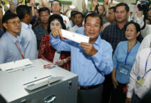 Cambodia’s Ruling Party Swept Seats, Official Results Show Cambodian Prime Minister Hun Sen, center, of the Cambodian People's Party (CPP), holds a ballot before voting July 29 at a polling station in Takhmua in Kandal province, southeast of Phnom Penh, Cambodia. Photo: Heng Sinith / Associated Press