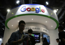 Opinion: How Humans Fit Into Google’s Machine Future Visitors gather at a display booth for Google at the 2016 Global Mobile Internet Conference (GMIC) in Beijing. Photo: Andy Wong / Associated Press