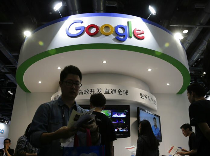 Visitors gather at a display booth for Google at the 2016 Global Mobile Internet Conference (GMIC) in Beijing. Photo: Andy Wong / Associated Press