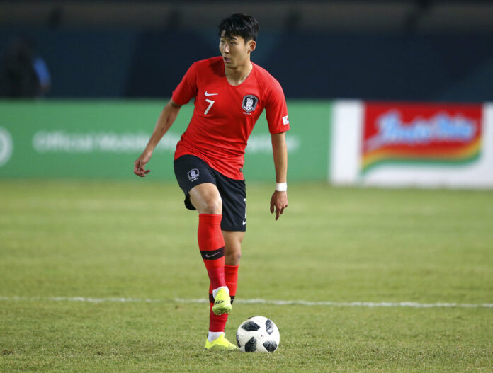 South Korea's Son Heung Min prepares to pass the ball in August during their men's football match between South Korea and Malaysia at the 18th Asian Games at Si Jalak Harupat Stadium in Bandung, Indonesia. Photo: Achmad Ibrahim / Associated Press