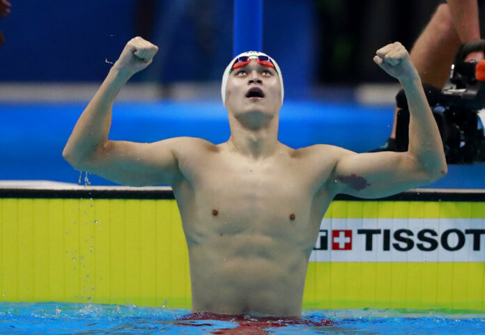 China's Sun Yang celebrates after winning the men's 200m freestyle final during the swimming competition at the 18th Asian Games Sunday in Jakarta, Indonesia. Photo: Bernat Armangue / Associated Press