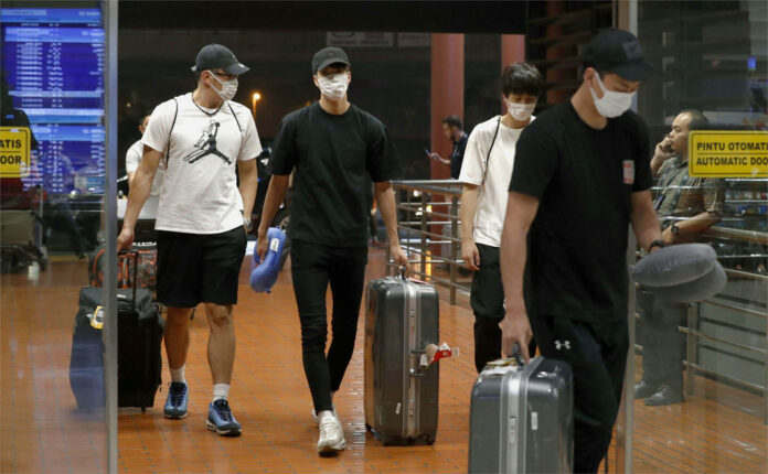 Four Japanese basketball players arrive at Jakarta airport Monday, Aug. 20, 2018. They were kicked off their Asian Games team and sent home Monday after delegation head Yasuhiro Yamashita said they 