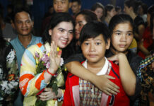 Hun Sen Considering Amnesty for Cambodian Prisoners Tep Vanny, second from left, a prominent leader of Cambodia's land rights activist, gestures upon the arrival at her home Monday in Boeung Kak, in Phnom Penh, Cambodia. Photo: Heng Sinith / Associated Press