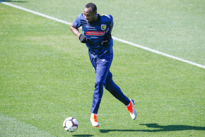 Jamaica's Usain Bolt trains with the Central Coast Mariners soccer team Tuesday in Newcastle, Australia. Photo: Steve Christo / Associated Press